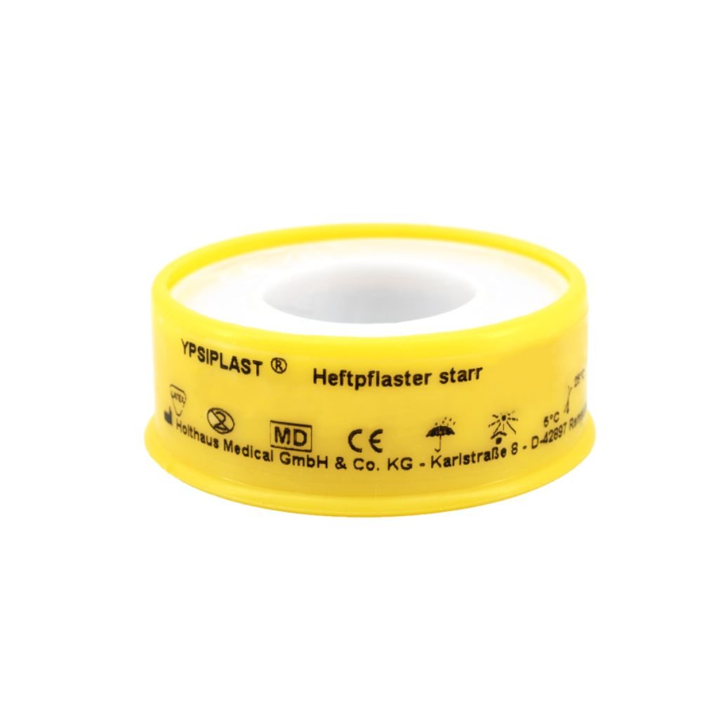 Le pansement adhésif rigide Holthaus Ypsiplast® de Holthaus Medical GmbH & Co. KG est un ruban adhésif médical doté d'une enveloppe en plastique jaune sur laquelle sont imprimés des textes et des symboles, destiné à un traitement efficace des plaies et doté d'une forte adhérence pour une utilisation médicale fiable.
