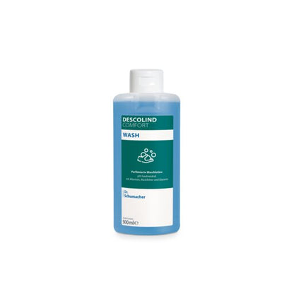 Une bouteille de 500 ml de lotion lavante Dr. Schumacher DESCOLIND COMFORT WASH de Dr. Schumacher GmbH avec un bouchon blanc, un liquide bleu et une étiquette avec de l'allantoïne et le logo Dr. Schumacher sur fond blanc.