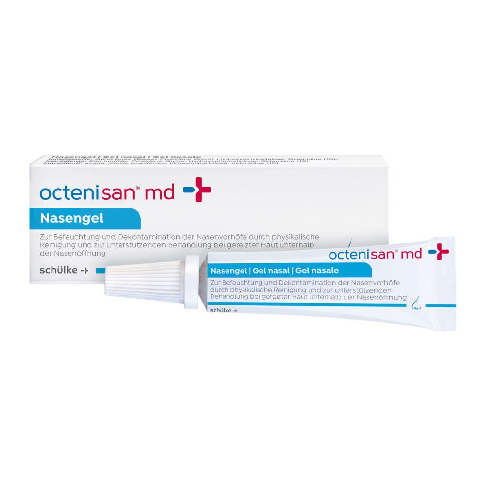 Illustré est un tube de gel nasal Schülke Octenisan® md (6 ml) de Schülke & Mayr GmbH avec emballage. Les deux tubes sont munis de texte bleu-rouge, de descriptions en allemand et d'un symbole de croix médicale indiquant l'utilisation pour la désinfection du vestibule nasal. Le tube a un bouchon blanc.