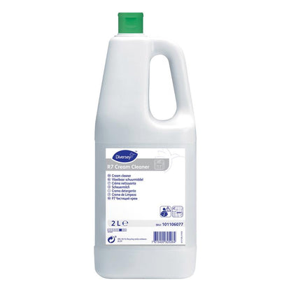 Une bouteille en plastique blanche de 2 litres de nettoyant crème Diversey R7 pour surfaces dures et résistantes à l'eau de Diversey Deutschland GmbH & Co. OHG, avec un bouchon vert et des instructions multilingues sur l'étiquette.