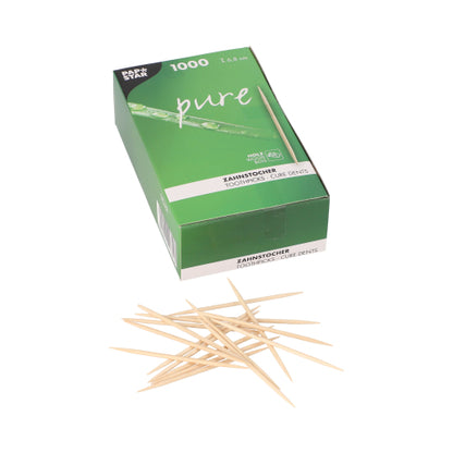 Une boîte "pure" verte avec l'inscription PAPSTAR cure-dents ronds en bois certifié FSC, 6,8 cm (1000 pièces) montre des cure-dents éparpillés sur le devant ; l'emballage contient des informations sur le produit en plusieurs langues.