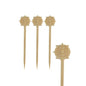Quatre PAPSTAR piques à finger food "Volant", 9 cm, avec des motifs de roues gravés de la PAPSTAR GmbH sont disposés sur un fond blanc. Pointus à une extrémité et plats à l'autre, ils sont parfaits pour le catering de fête.
