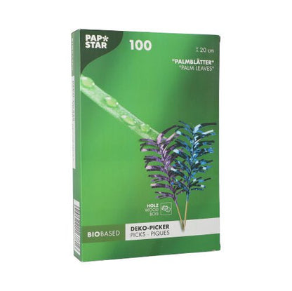 Le PAPSTAR 100 Deko-Picker de la société PAPSTAR est une boîte verte contenant 100 picks en feuille de palmier biosourcés, chacun mesurant 20 cm de long. L'emballage montre une image et des photos des picks en bleu et violet - idéal pour les buffets et les présentations élégantes.