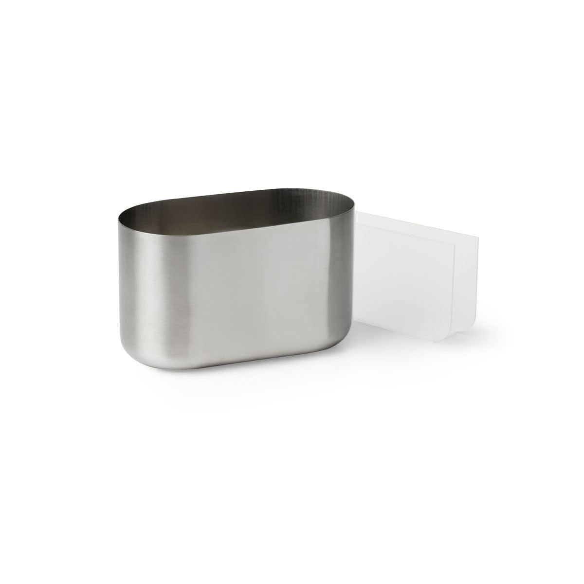 Le porte-couverts et serviettes ovale Pond de Duni GmbH, un porte-table ovale en acier inoxydable avec un dessus ouvert et un accessoire latéral rectangulaire blanc, est représenté sur un fond blanc simple.