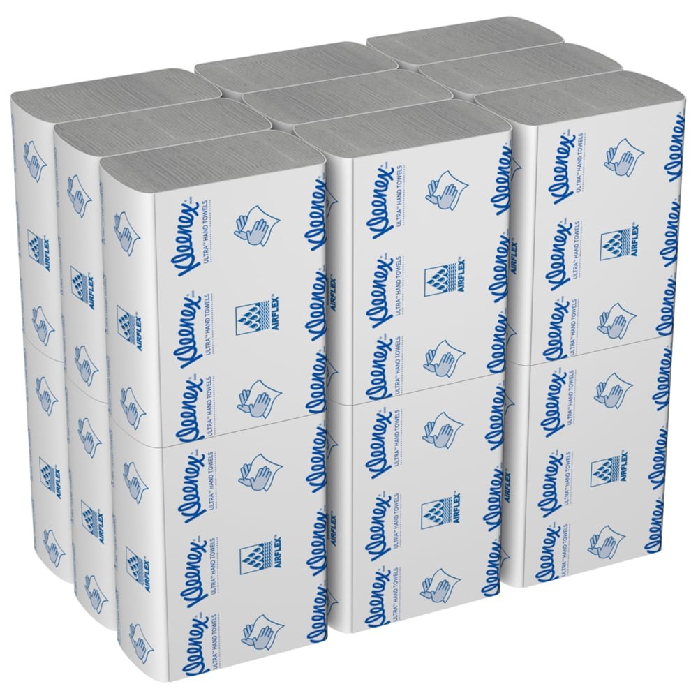 Un carton de serviettes à main Kleenex® Ultra™ de Kimberly-Clark GmbH contient 18 paquets MultiFold blancs de 150 feuilles avec des textes et symboles bleus sur l'emballage.