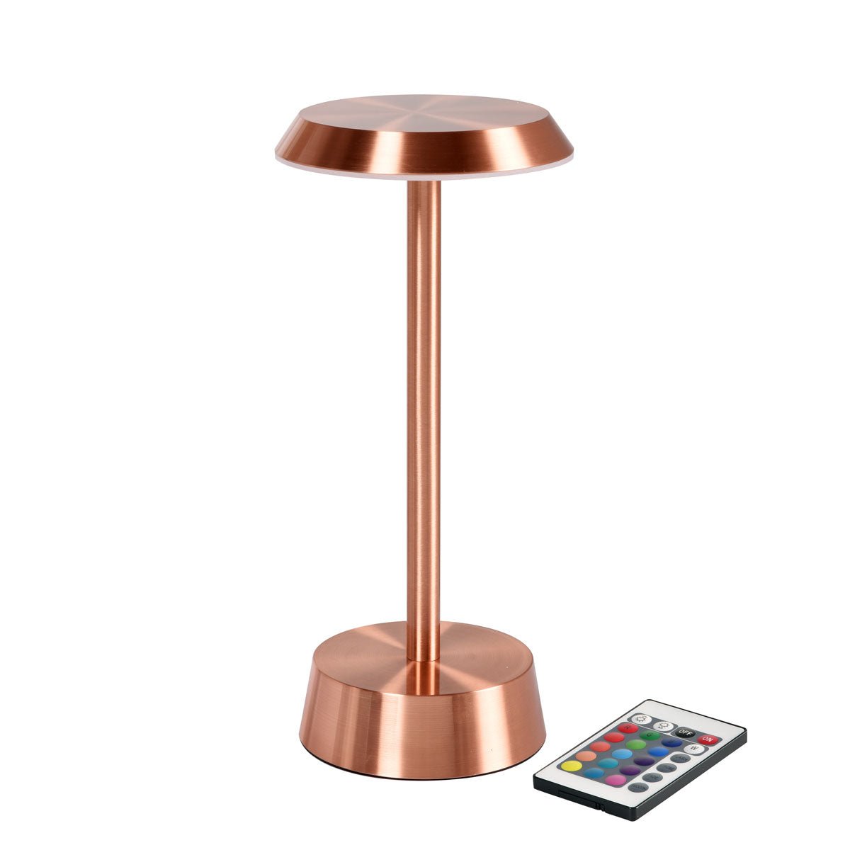 La lampe LED NOUR sans fil en or rose de Duni GmbH a une base ronde et un dessus plat pour un style moderne. À côté de la lampe se trouve une télécommande avec des boutons colorés.