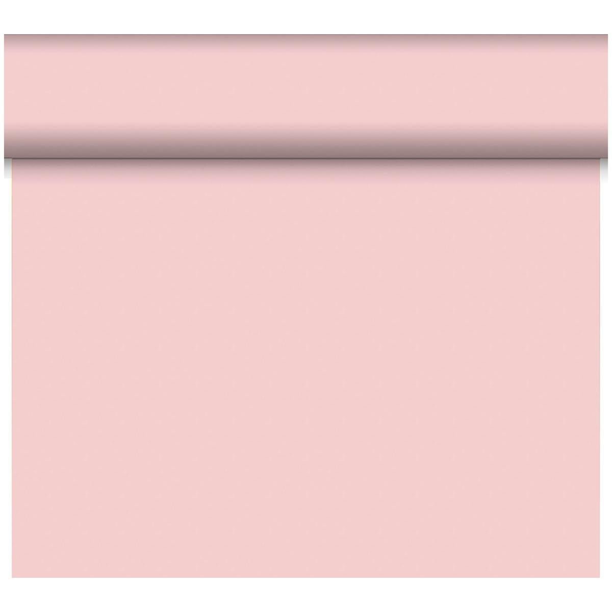 Un rouleau de papier peint rose clair Bio-DC-Tete a Tete 0,4x24m de Duni GmbH est partiellement déroulé, révélant sa surface lisse et solide ; la partie supérieure reste enroulée tandis que le reste pend verticalement.