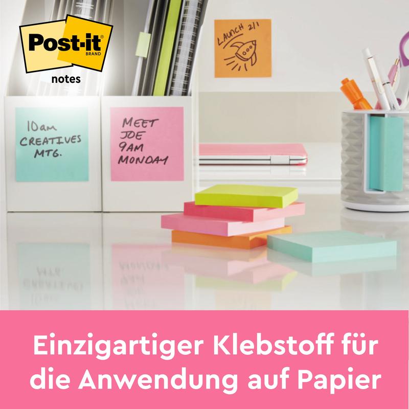 Un bureau avec des Post-it® Notes roses (76 x 76 mm, 100 feuilles/bloc, 6 blocs), des stylos, des notes de réunion dans des cadres blancs et un rappel pour le déjeuner. Allemand : "Adhésif unique pour papier". Certifié PEFC à 100% par 3M Deutschland GmbH.