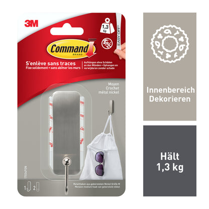 Der mittelgroße Command™ Metallhaken in gebürstetem Nickel (1 Haken, 2 Strips) von 3M Deutschland GmbH kommt ohne Bohren aus. Die Verpackung zeigt Produkt, Anwendungstipps und Beispiele mit Tasche und Sonnenbrille.