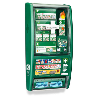 La station de premiers secours & brûlures Cederroth d'Orkla Wound Care AB contient des bandages, du gel pour brûlures, des pansements, des illustrations, des compartiments étiquetés et un distributeur de pansements dans une station verte.