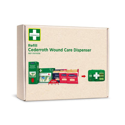 Un carton avec l'inscription "Recharge de premiers secours Cederroth pour distributeur de soin des plaies REF 51011006" de Orkla Wound Care AB, montrant divers produits de premiers secours et un distributeur vert sur le devant.