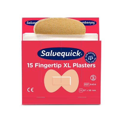 Une boîte rouge de pansements textiles pour le bout des doigts Orkla Wound Care AB XL, 15 pièces/Mine (paquet de 6 pièces), avec un pansement partiellement retiré. L'emballage présente le marquage CE, les dimensions et une illustration de la forme des bouts des doigts.