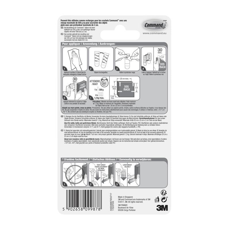 Au dos d'un paquet de la 3M Deutschland GmbH Petite Command™ Strips S, 17022N se trouvent des instructions illustrées et multilingues pour appliquer et retirer les bandes adhésives sans clous, afin de préserver les murs sans dommage, ainsi qu'un code-barres au bas.