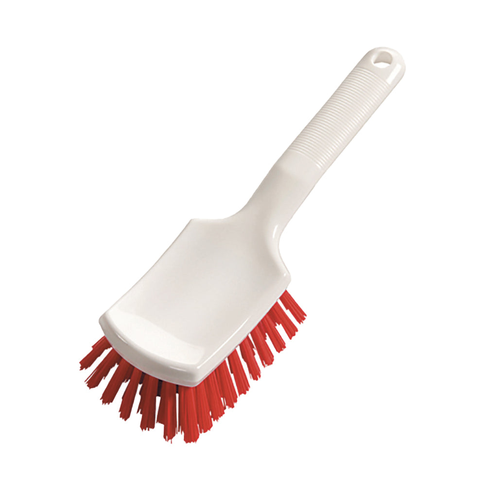 La brosse à manche 260 x 72 x 35 mm de Diversey Deutschland GmbH & Co. OHG dispose d'un manche court avec une surface de préhension texturée et un trou de suspension, ainsi que des poils rouges durs et un manche blanc - idéale pour récurer les surfaces.
