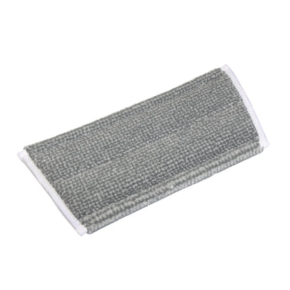 Le TASKI Jonmaster Pro HD Scheuermopp de Diversey Deutschland GmbH & Co. OHG est un tampon en microfibre gris rectangulaire avec un bord blanc, idéal pour les tâches de nettoyage professionnelles.