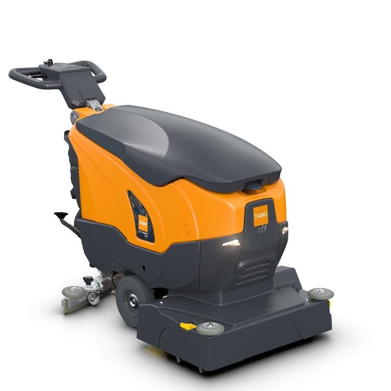 La TASKI ULTIMAXX 900 RB45 P BMS 13A gel ready de Diversey Deutschland GmbH & Co. OHG est une autolaveuse orange/grise pour usage commercial, idéale pour le nettoyage de bâtiments et les grandes surfaces, équipée de roues, poignée et accessoires de brosses.