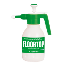 Eine weiße Kunststoff-Sprühflasche Dr. Schnell Drucksprüher 1,5 Liter von DR.SCHNELL GmbH & Co. KGaA, mit grüner Pumpe und Düse, mit der Aufschrift "FLOORTOP" in großen Buchstaben und "DR. SCHNELL" in deutscher Schrift am Boden.