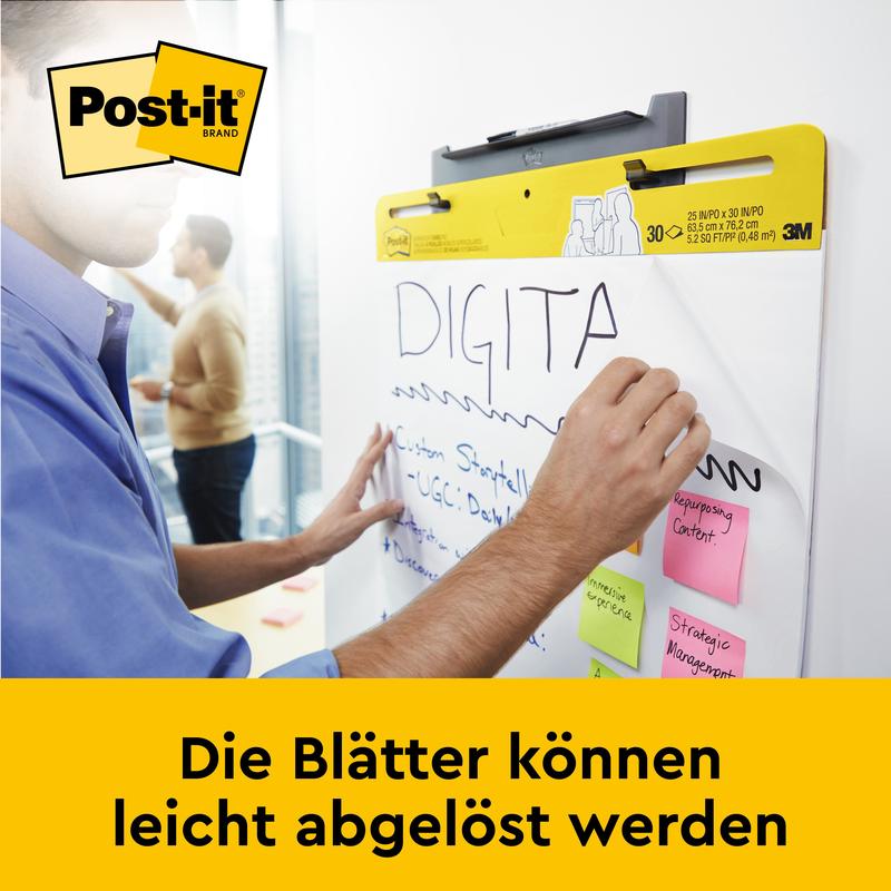 Quelqu'un écrit sur le tableau de réunion auto-adhésif Post-it® Super Sticky/flipchart pour montage mural 559 (63,5 x 76,2 cm) de 3M Deutschland GmbH. Plusieurs notes autocollantes y sont collées. Les feuilles se détachent facilement.