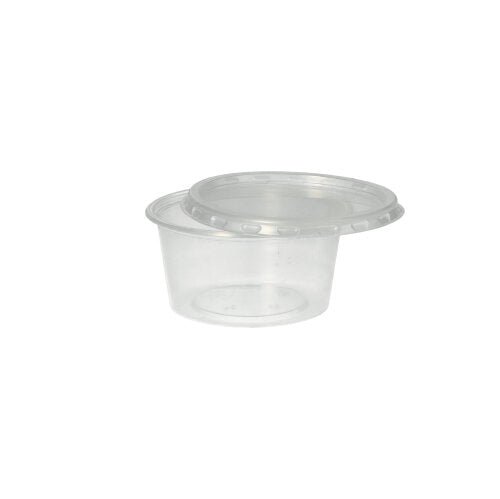 Le gobelet Starpak 50 Dressing, PP rond Ø 7,1 cm transparent, est un gobelet en polypropylène transparent avec un couvercle à pression - idéal pour le service traiteur. Présenté sur un fond blanc simple.