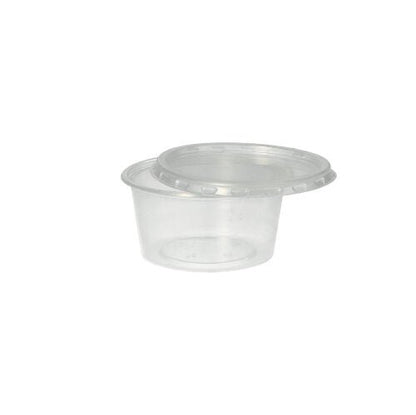 Le gobelet Starpak 50 Dressing, PP rond Ø 7,1 cm transparent, est un gobelet en polypropylène transparent avec un couvercle à pression - idéal pour le service traiteur. Présenté sur un fond blanc simple.