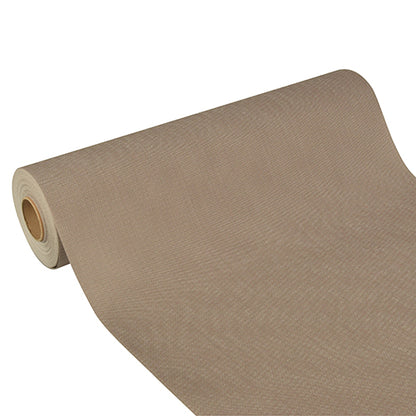 Le chemin de table Starpak «Soft Selection Plus» en non-tissé semblable à du tissu (24 m x 40 cm) en beige est partiellement déroulé sur un fond blanc – parfait pour des occasions festives.
