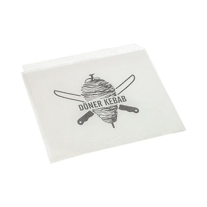 Les PAPSTAR sacs à döner kebab, substitut de parchemin, 16x16 cm, film rétractable résistant à la graisse (1000 pièces) de PAPSTAR GmbH est un emballage alimentaire blanc durable avec une broche à döner et des couteaux croisés ainsi que le texte "DÖNER KEBAB".
