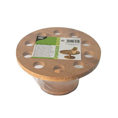 Un support rond en bambou pour cornets (Ø 18 cm) de PAPSTAR GmbH, avec dix trous, emballé dans du plastique et une étiquette vert-blanc sur le dessus avec des idées pour la présentation de cornets et des informations détaillées sur le produit.