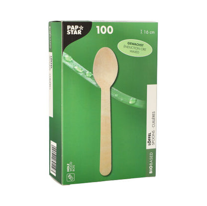 Une boîte verte et blanche de PAPSTAR GmbH avec l'inscription "cuillère en bois pure" contient 100 cuillères en bois cirées, écologiques (16 cm) dans une boîte pliante - idéale pour la gastronomie, avec un motif de cuillère et de feuille sur le devant.