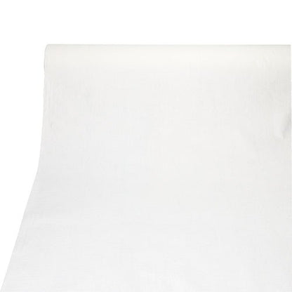 Une nappe de la PAPSTAR GmbH de la collection ROYAL (PV-Tissue Mix, 20 m x 1,18 m) est déroulée sur une surface plane, au premier plan, on peut voir sa structure lisse semblable à du tissu et ses bords droits.