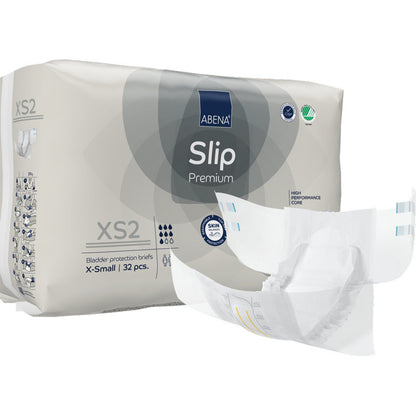 Un paquet de ABENA Slip Premium de Abena Re-Seller GmbH, taille X-Small, avec 32 slips de protection. Un slip est illustré déplié à l'avant, montrant son design pour une prise en charge efficace de l'incontinence.