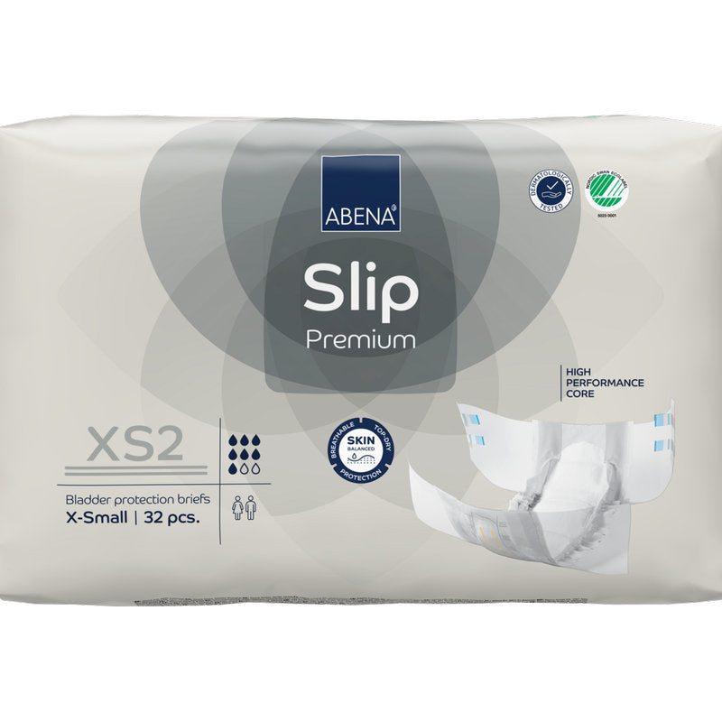 Un paquet de 32 ABENA Slip Premium de Abena Re-Seller GmbH en taille XS2 X-Small dans un emballage beige avec les certifications "High Performance Core" et "Skin Friendly" pour une prise en charge fiable de l'incontinence.
