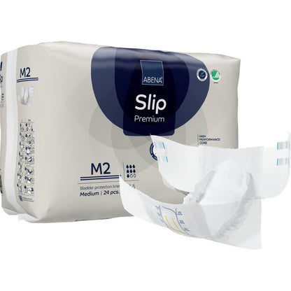 Derrière une couche dépliée est illustré un paquet de ABENA Slip Premium de Abena Re-Seller GmbH, taille M2. L'emballage indique qu'il contient 24 slips de taille moyenne pour une prise en charge fiable de l'incontinence.