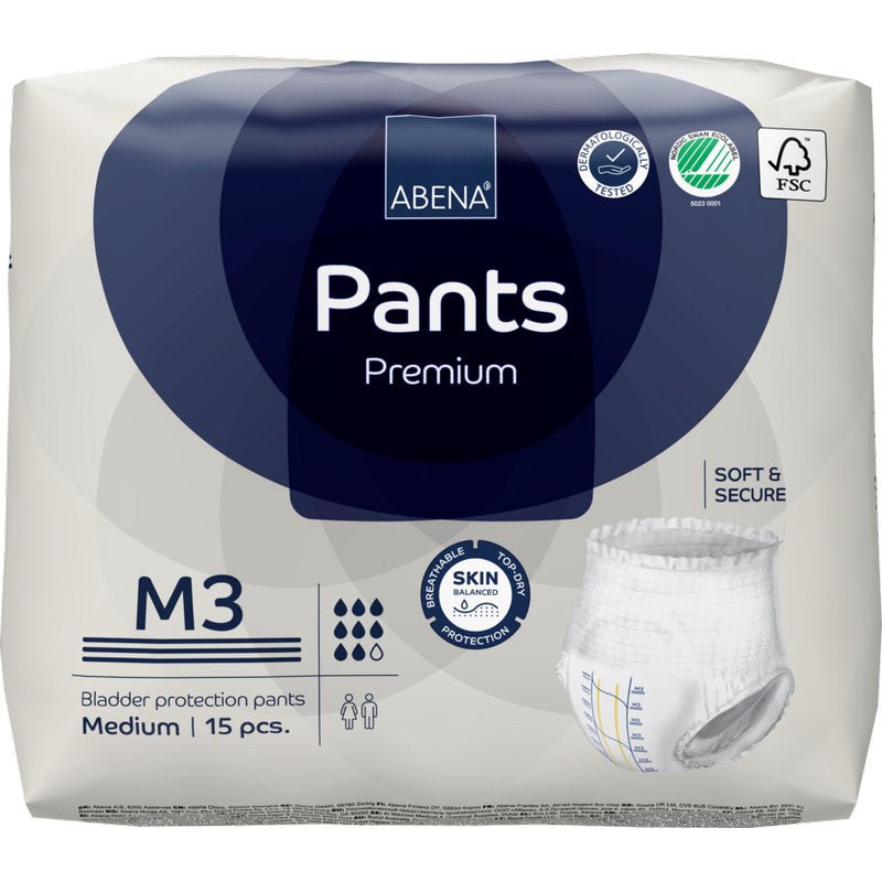 Un paquet de ABENA Pants Premium M de Abena Re-Seller GmbH, taille moyenne, 15 pièces. L'emballage met en avant la protection de la peau, la douceur, la sécurité et la certification écologique. Contient une image du pantalon jetable.