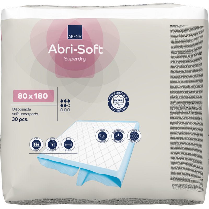 Un paquet de 30 protections jetables Abri-Soft Superdry (80x180 cm) de Abena Re-Seller GmbH. L'emballage met en avant l'utilisation pour l'incontinence, montre la taille et affiche des images de la construction douce de la protection.