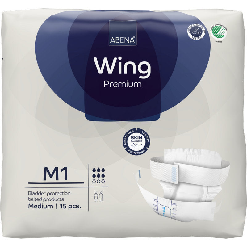 Un paquet de 15 slips d'incontinence ABENA Wing Premium avec ceinture, medium, de Abena Re-Seller GmbH. L'emballage blanc avec des accents bleu foncé montre des symboles de produit et une illustration du slip pour une protection et un confort optimaux.