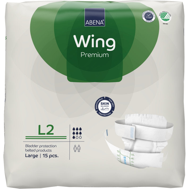 Emballage de l'ABENA Wing Premium d'Abena Re-Seller GmbH, taille Large, 15 pièces. L'emballage blanc et vert montre des détails du produit, une image de la couche et met en avant "protection et confort" pour une protection fiable de la vessie.