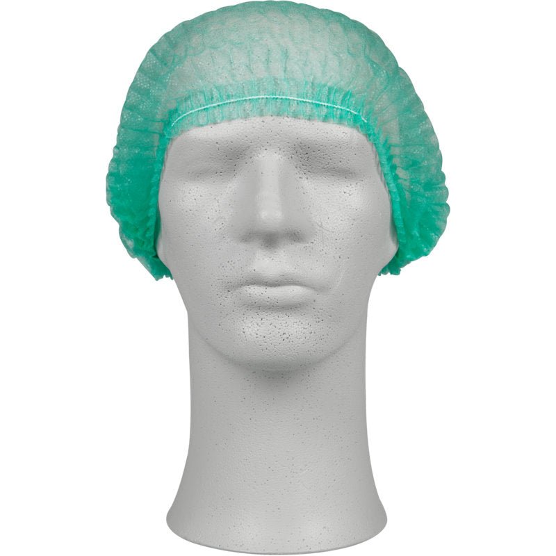Une tête de mannequin blanche montre une charlotte verte en PP de la société Abena Re-Seller GmbH, idéale pour la protection hygiénique dans le domaine médical ou dans la gastronomie. Le mannequin est orienté vers l'avant et se tient devant un fond simple.