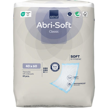 Un paquet de 60 protections jetables Abri-Soft Classic de Abena Re-Seller GmbH, 40x60 cm, Bleu. L'emballage principalement blanc et gris clair met en avant la douceur, l'imperméabilité et la protection supplémentaire.