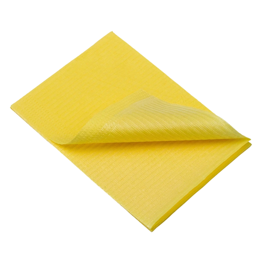 Un chiffon de nettoyage jaune plié, similaire aux serviettes patients jetables AMPri Dental de la AMPri Handelsgesellschaft mbH, repose sur un fond blanc. Sa surface texturée et son matériau doux et absorbant suggèrent une polyvalence pour diverses tâches de nettoyage.