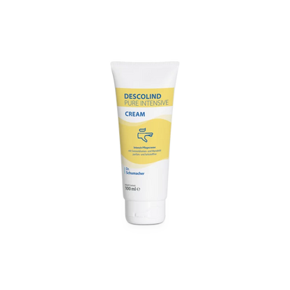 Un tube de 100 ml de la crème intensive Descolind Pure de Dr. Schumacher GmbH, une crème de soin intensif non parfumée pour peaux sensibles et sèches avec une étiquette jaune et blanche, est placé debout devant un fond blanc.