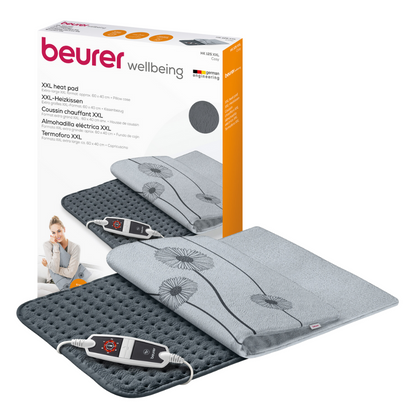 Illustration du Beurer coussin chauffant HK 125 XXL Cosy Grey Sets. Le coussin chauffant gris a une surface pelucheuse avec un motif floral simple et dispose d'un régulateur électronique avec 6 réglages de température. Sur l'emballage, on peut voir le nom de la marque « Beurer GmbH » et les détails du produit en plusieurs langues, certifiés selon OEKO-TEX® STANDARD 100.