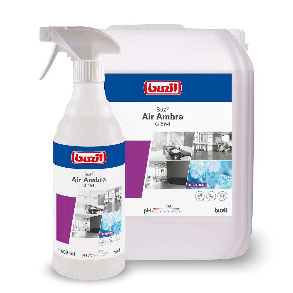 Sont présentés deux conteneurs avec des produits de nettoyage : un flacon pulvérisateur et un grand bidon de recharge. Les deux portent l'étiquette « Buzil Buz® Air Ambra G 564 Spray prêt à l'emploi avec bloqueur d'odeurs actif » de BUZIL-WERK Wagner GmbH & Co. KG, sur laquelle sont représentés des pièces propres et de l'eau, ainsi qu'un bloqueur d'odeurs actif pour une fraîcheur durable.