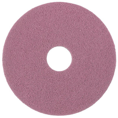 Das Diversey Twister Pad Pink für Vinylböden von Diversey Deutschland GmbH & Co. OHG ist ein rundes, strukturiertes rosa Reinigungspad mit einem zentralen Loch, von oben gesehen, ideal zum Reinigen oder Polieren von Vinylböden.