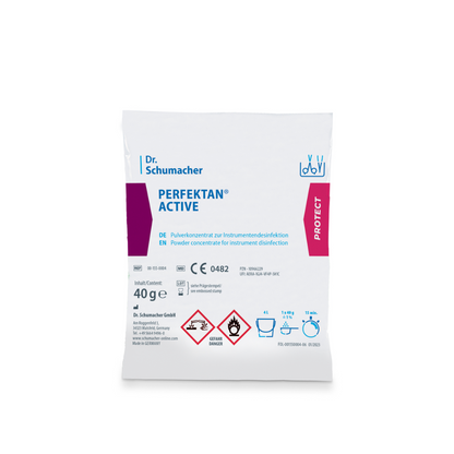 Ceci est une image d'un paquet blanc portant l'inscription « Dr. Schumacher Perfektan® Active Instrumentendesinfektion » de Dr. Schumacher GmbH. L'emballage indique qu'il s'agit d'un concentré en poudre d'acide peracétique pour la désinfection des instruments. Il contient 40 grammes et est muni de symboles de danger, d'instructions d'utilisation et de marques de certification.