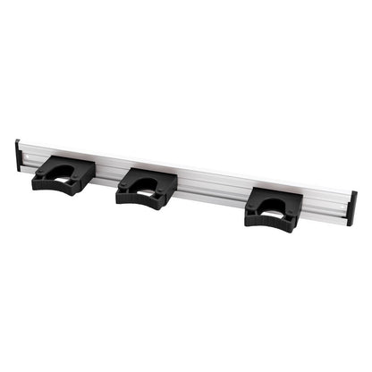 La Haug Bürsten KG ALU-GERÄTELEISTE, 3 SUPPORTS DE MANCHE, 510x55mm est un organisateur mural avec trois supports en plastique noir pour le rangement pratique d'outils ou d'équipements.