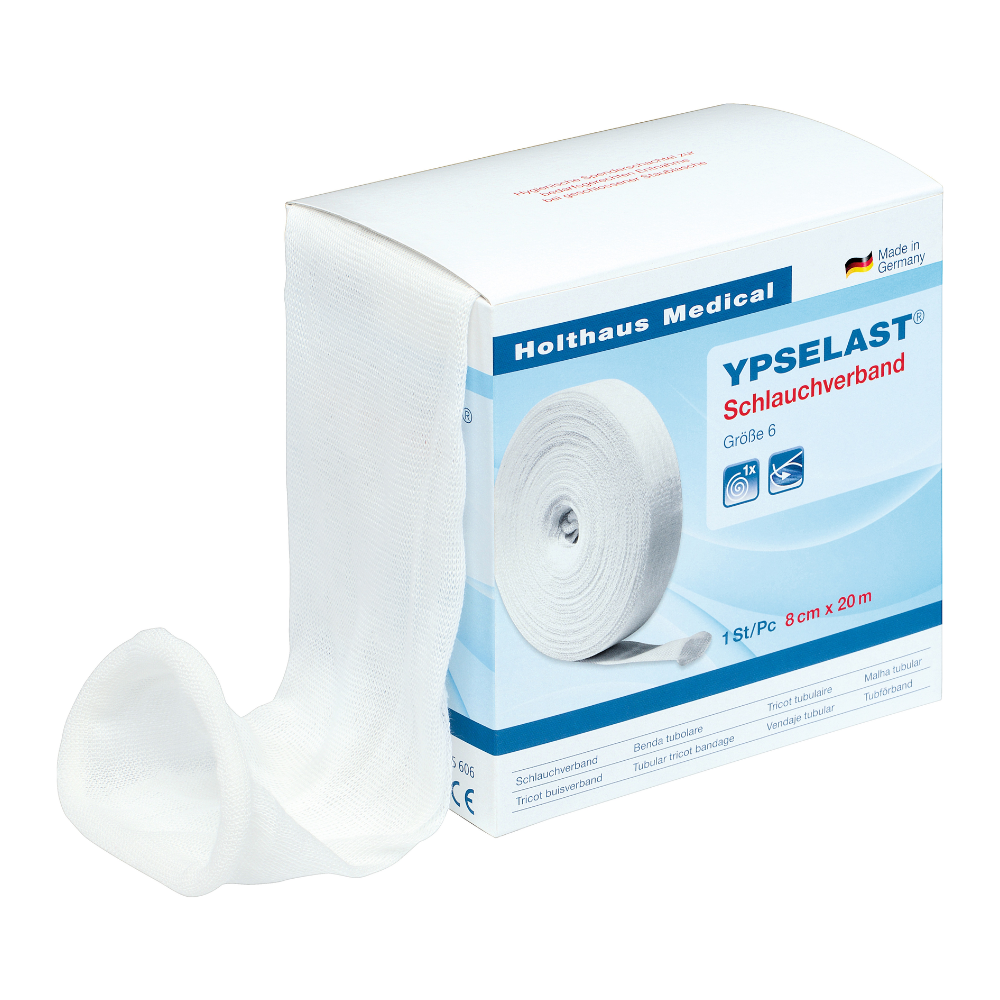 Une boîte blanche de bandage tubulaire Holthaus Ypselast® de différentes tailles de Holthaus Medical GmbH & Co. KG. La boîte contient du texte bleu et rouge ainsi qu'une image du bandage partiellement déroulé. Le bandage a une largeur de 8 cm et une longueur de 20 m et il est indiqué sur l'emballage qu'il est fabriqué en Allemagne.
