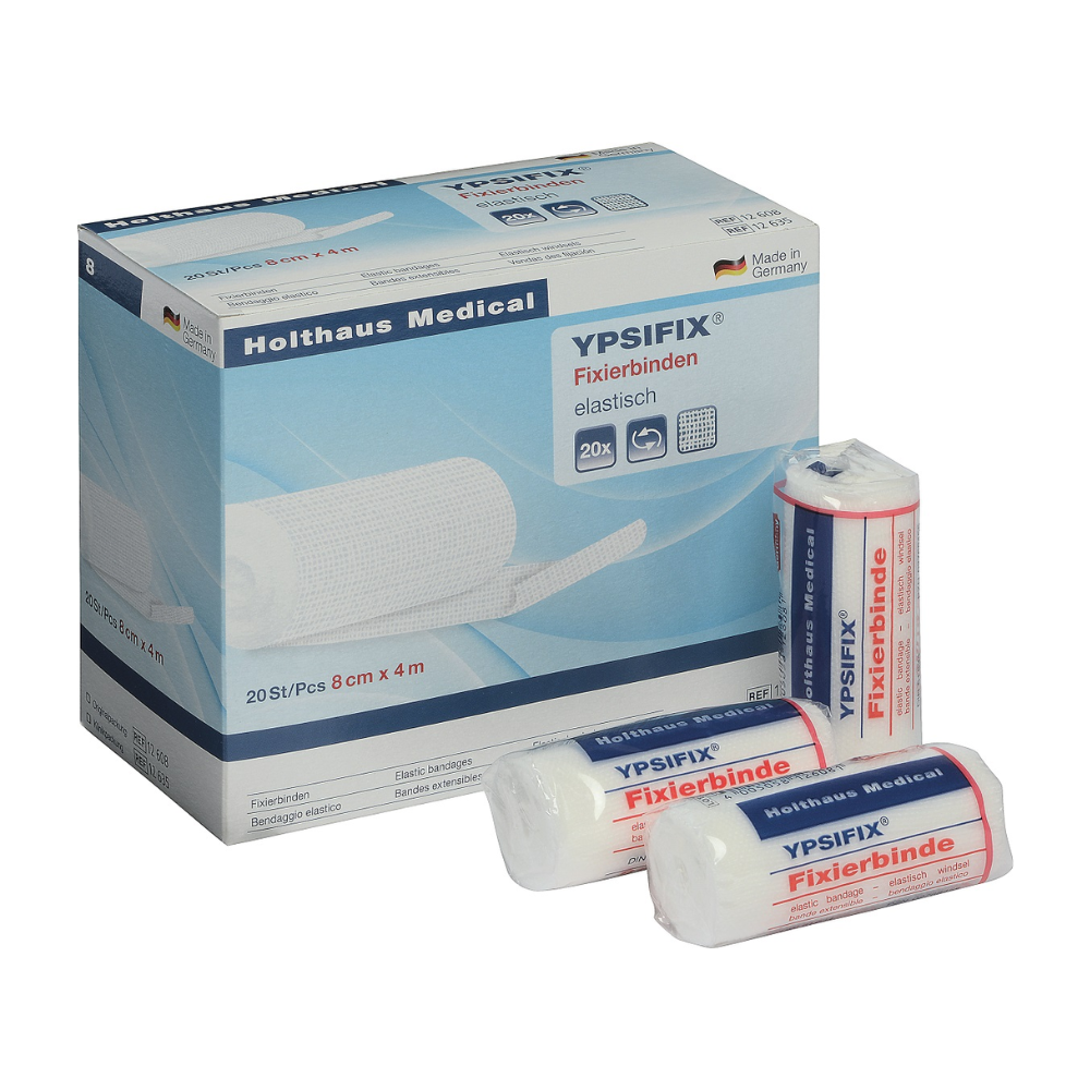 Illustration d'une boîte de bandage de fixation Holthaus Ypsifix® de Holthaus Medical GmbH & Co. KG, 8 cm x 4 m. La boîte contient 20 bandages individuels. Trois bandages individuels sont représentés à l'avant de la boîte ; deux sont emballés sous plastique, tandis qu'un est partiellement déballé. Fabriqué en Allemagne, parfait pour fixer les pansements.