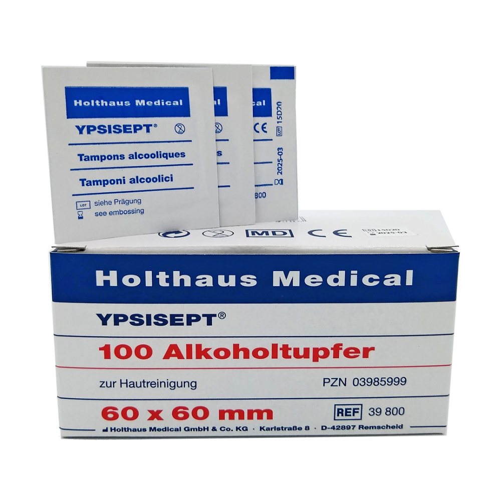 Image d'une boîte Holthaus Medical GmbH & Co. KG Holthaus Ypsisept® Tampons alcoolisés 60 x 60 mm, 100 pièces | Emballage (1 pièce). La boîte contient le texte « 100 tampons alcoolisés pour le nettoyage de la peau » et « 60 x 60 mm ». Derrière la boîte se trouvent plusieurs sachets individuels de tampons alcoolisés à l'isopropyle.