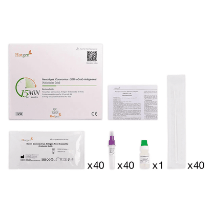 L'image montre un kit de test antigénique Hotgen soigneusement ordonné (or colloïdal) avec approbation professionnelle pour le Covid-19, comprenant une boîte étiquetée, une feuille d'instructions et un emballage de cassette de test antigénique de la marque Hotgen 2019-nCoV. Le kit comprend 40 cassettes de test, 40 flacons pour les échantillons, un écouvillon et 40 bouchons.