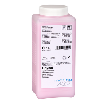 Debout, une bouteille rectangulaire en plastique rose avec l'inscription "Kiehl Opysat Handwasch-Lotion" de Johannes Kiehl KG. Le savon pour les mains de 1 litre, au pH neutre, est idéal pour un nettoyage doux des mains, avec des instructions d'utilisation et des détails sur l'étiquette.